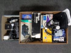 A box containing digital cameras, camera flashes, camcorder,