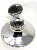 A large silver inkwell, with glass liner, Birmingham marks rubbed, diameter 18cm.