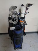 Three golf bags by Ping and Prosimmon containing a large quantity of assorted irons and drivers to