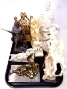 A tray of metal and resin ornaments depicting classical warriors, the three graces,