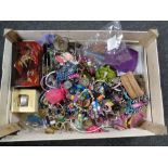 A crate containing a large quantity of costume jewelry