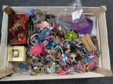 A crate containing a large quantity of costume jewelry
