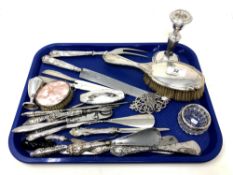 A tray of silver ware including weighted silver candlestick, dressing table items,