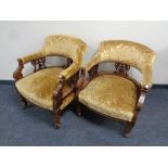 A pair of 19th century carved mahogany tub armchairs upholstered in a gold brocade fabric