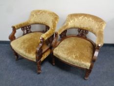 A pair of 19th century carved mahogany tub armchairs upholstered in a gold brocade fabric