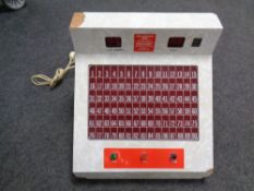 A mid 20th century melamine cased electric bingo machine