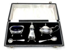 A silver five piece cruet set,