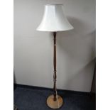 A beechwood standard lamp with shade