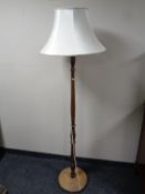 A beechwood standard lamp with shade