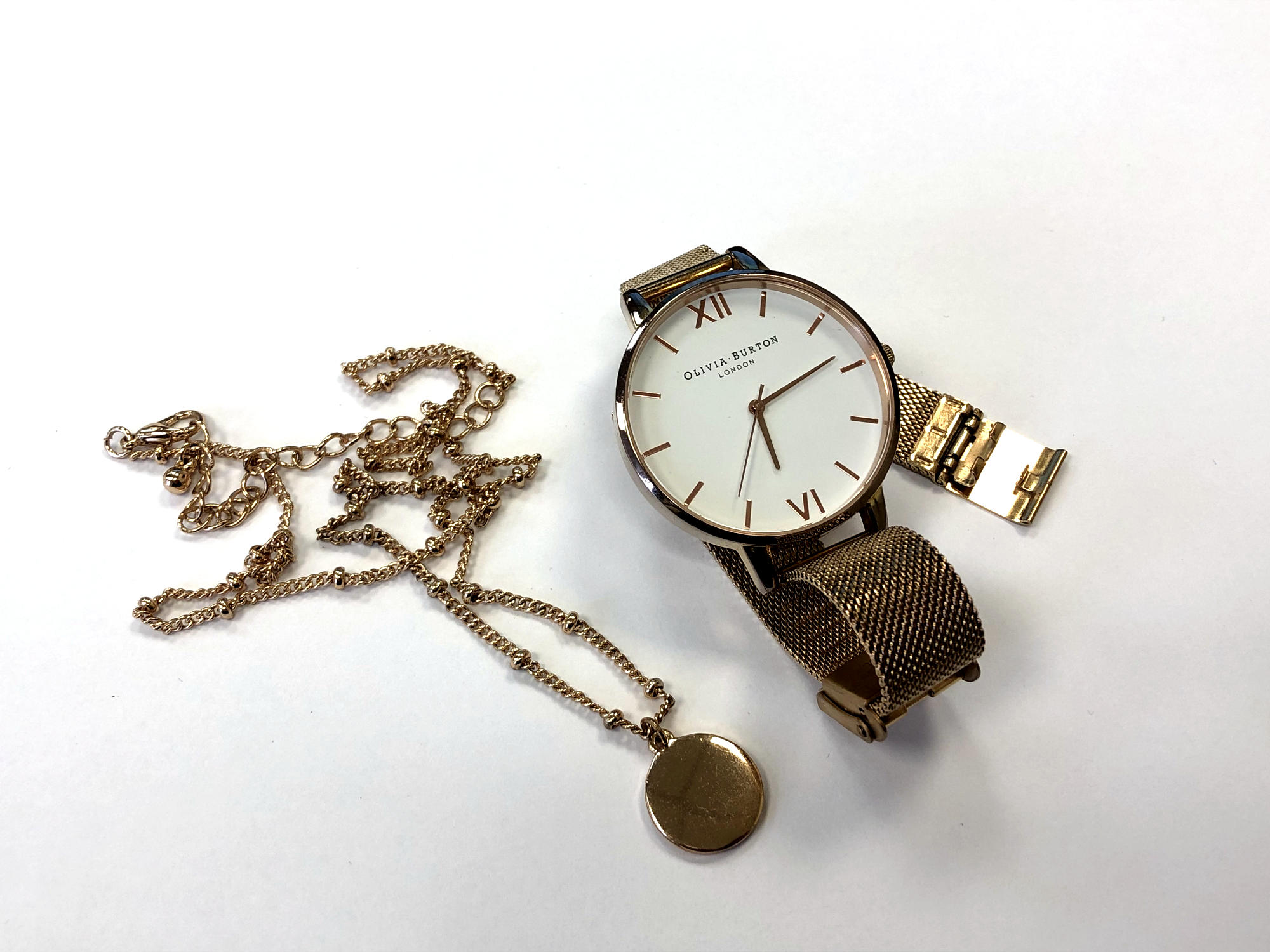 An Olivia Burton lady's watch together with a fancy link costumer necklace with pendant