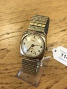 A gent's vintage Avia 9ct gold cushion shaped wristwatch on plated expanding strap