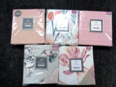 A basket of five Dunelm double duvet sets and duvets (new and sealed)