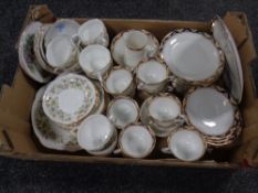 A box containing a antique Foley china tea service together with a further part Duchess bone china