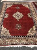 A Persian Tabriz carpet on red ground 198cm x 280cm