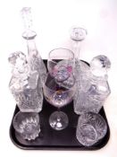 A tray of four assorted cut glass decanters with stoppers,