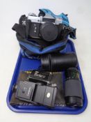 A tray of a Zenit-E camera with lens in bag,