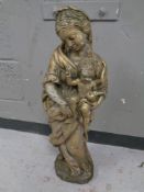 A gilt composition figure garden figure of a lady and infant,