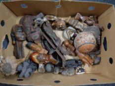 A box containing a quantity of assorted African and eastern tourist carvings