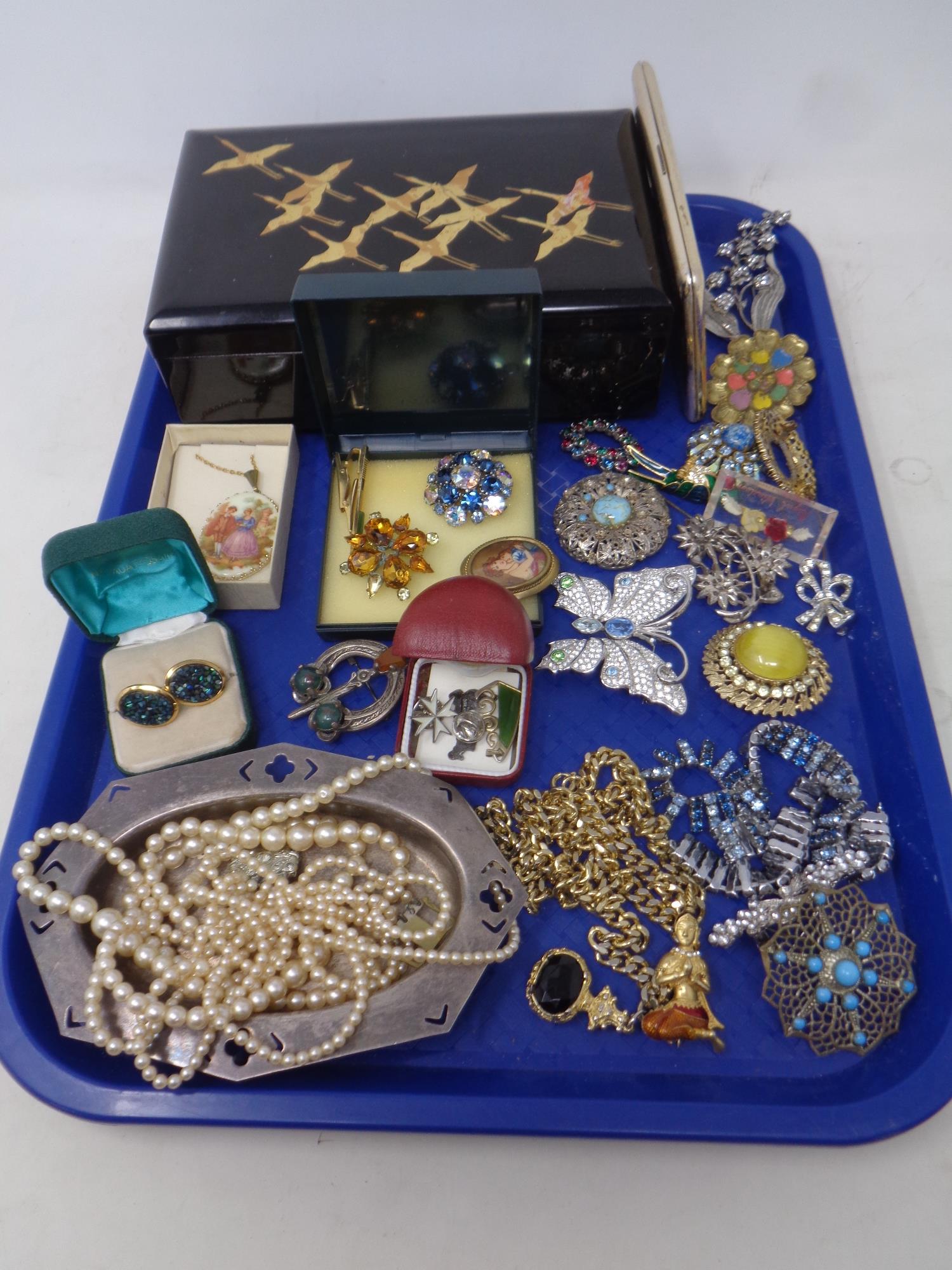 A tray of lacquered jewellery box, cigarette case, plated dish,