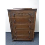 A 20th century oak 5 drawer chest