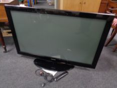 A Samsung 50" plasma TV with lead and remote