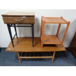 A 20th century teak refectory coffee table with under shelf together with a further two tier table