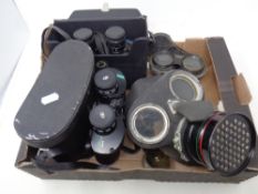 A box of WWII gas mask in original box, Chinon and Miranda field glasses in case,