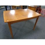 A mid 20th century rectangular extending dining table together with a pair of mid 20th century