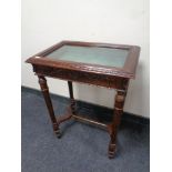 A reproduction mahogany curio table