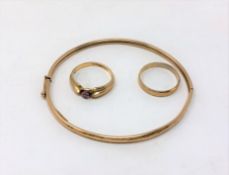 A 9ct gold bangle and two similar rings CONDITION REPORT: 5.