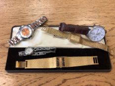 A group of lady's and gent's watches including Limit, Gucci,