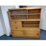 A 20th century bureau display wall unit in a teak finish