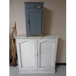 A nineteenth century painted pine double door bookcase together with a further painted bedside