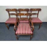 A set of four 19th century mahogany dining chairs comprising of scroll arm armchair and three