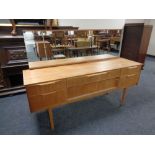 A mid 20th century teak six drawer dressing chest