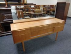 A mid 20th century teak six drawer dressing chest