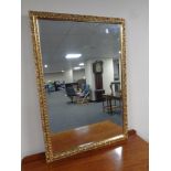 A 20th century gilt framed bevel edged mirror