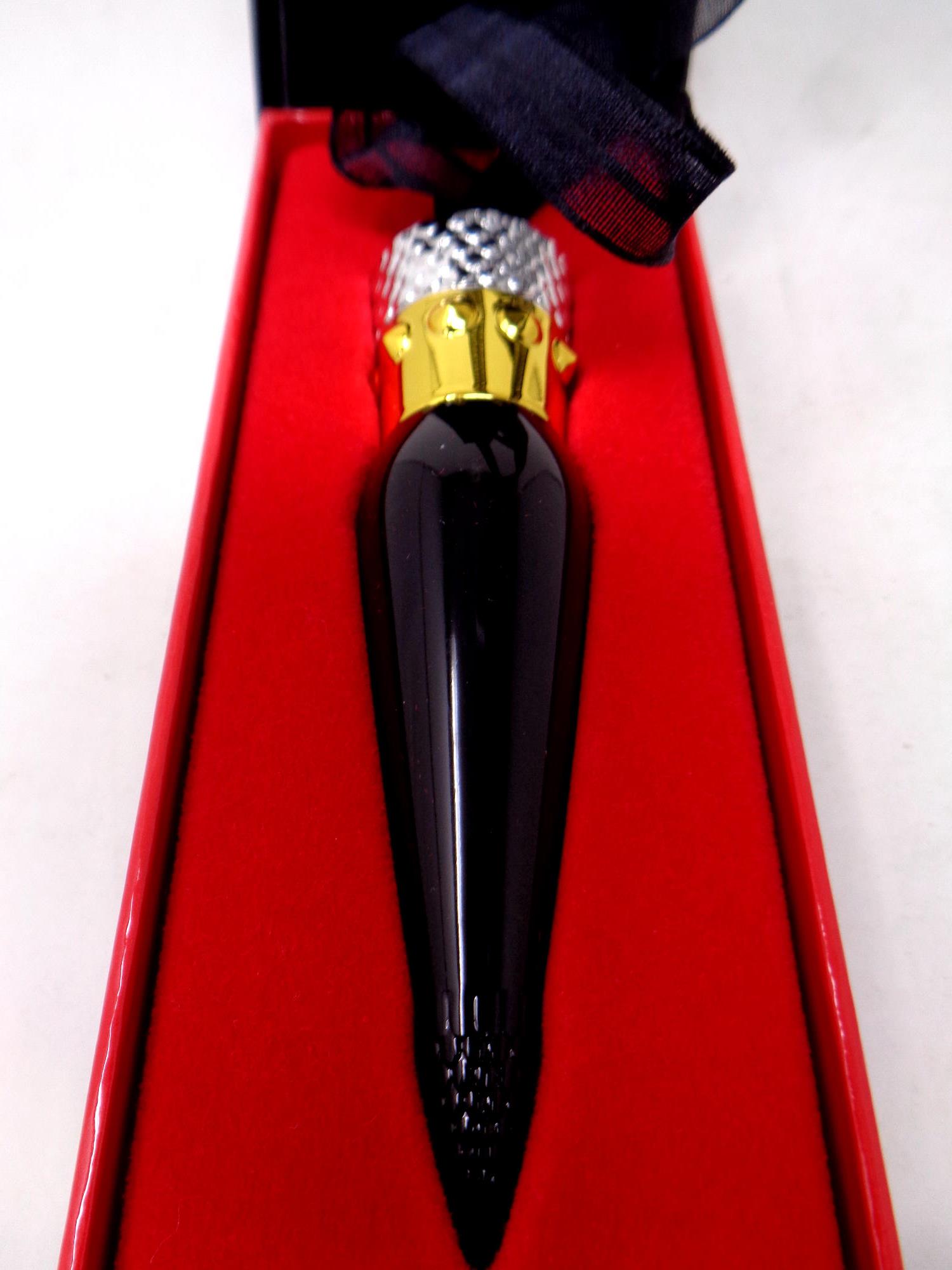 A boxed Christian Louboutin rouge lipstick