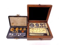 Two boxed part sets of precision weights