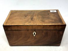 A Victorian inlaid mahogany tea caddy, with twin-compartment fitted interior, 31 cm x 16 cm x 16cm.