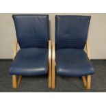 A pair of Alan Cooper beach framed chairs upholstered in blue leather