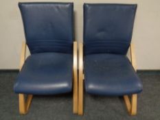 A pair of Alan Cooper beach framed chairs upholstered in blue leather