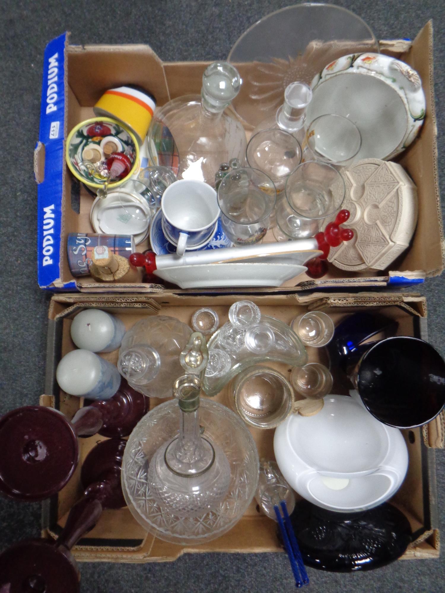 Two boxes containing miscellaneous glassware and ceramics to include ship's decanter, claret jug,