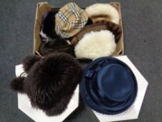 A box and two John Lewis hat boxes containing a quantity of lady's hats to include Burberry and fur