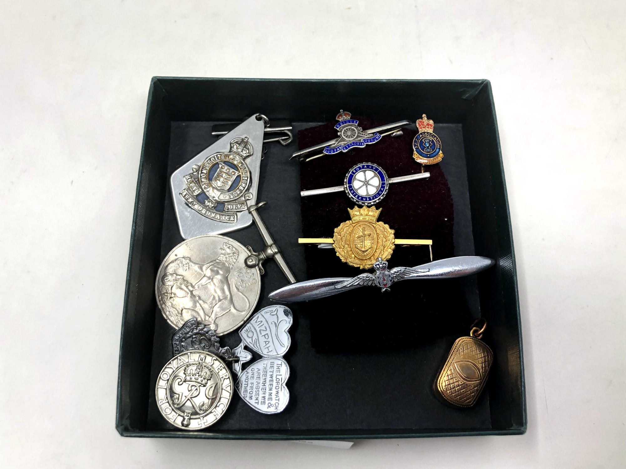 A group of military brooches including a silver Royal Artillery example, War Medal,