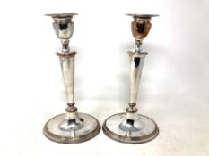 A pair of silver plate on copper candlesticks, height 27cm.