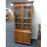 A Chapman's Siesta double door bookcase fitted with cupboards beneath, height 182 cm, width 76.