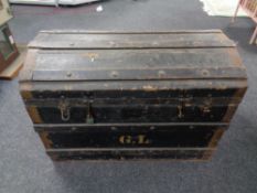 A Edwardian wooden bound dome topped shipping trunk, height 53 cm, width 76 cm, depth 47 cm.