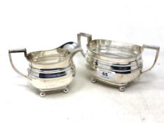 A silver sugar pot and matching cream jug, William Hutton & Sons Ltd, Sheffield 1944.