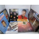 A crate containing a small quantity of LPs to include The Beatles 1967/1970's double album, Elvis,